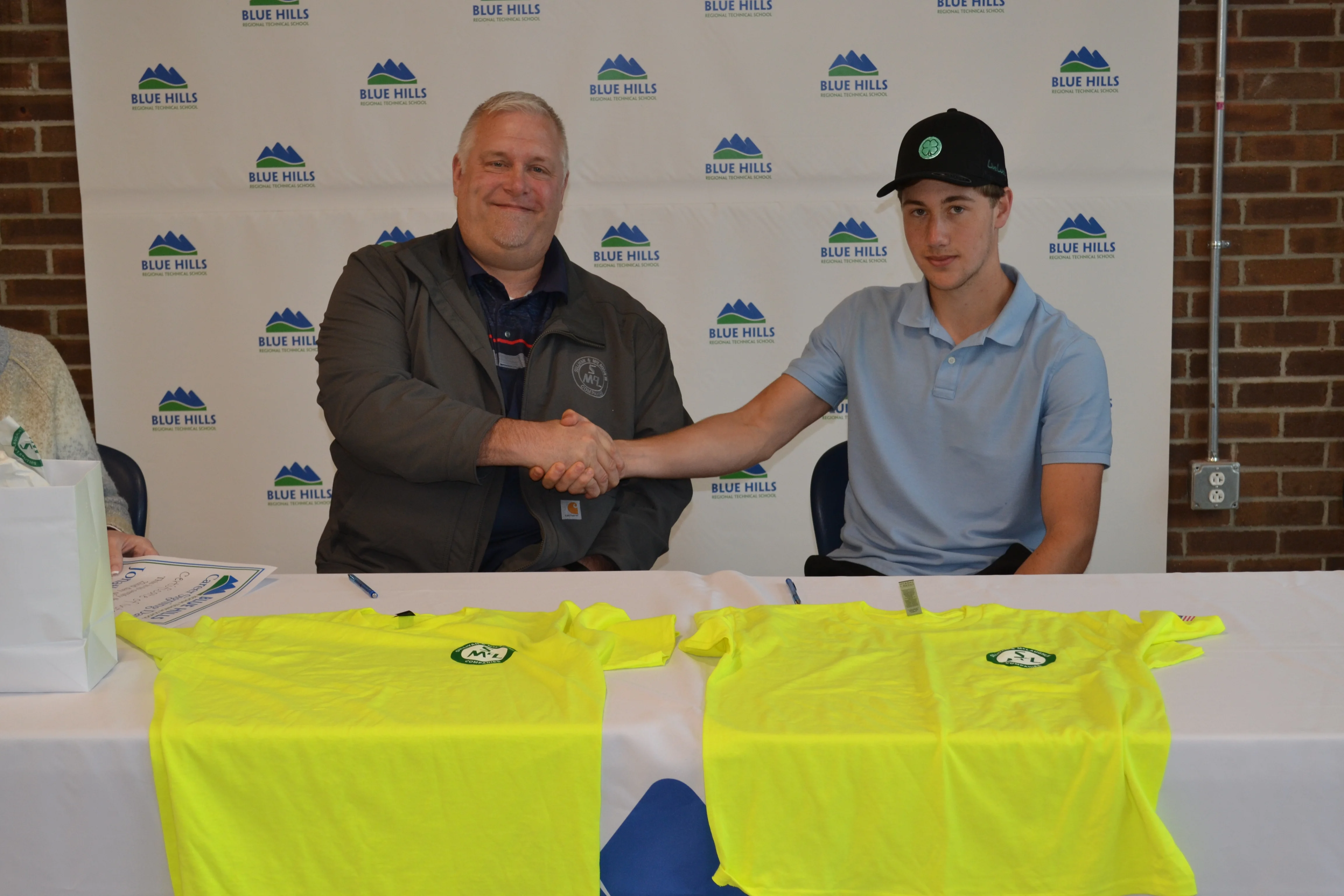 Jonathan Fagan shakes hand of prospective employer.
