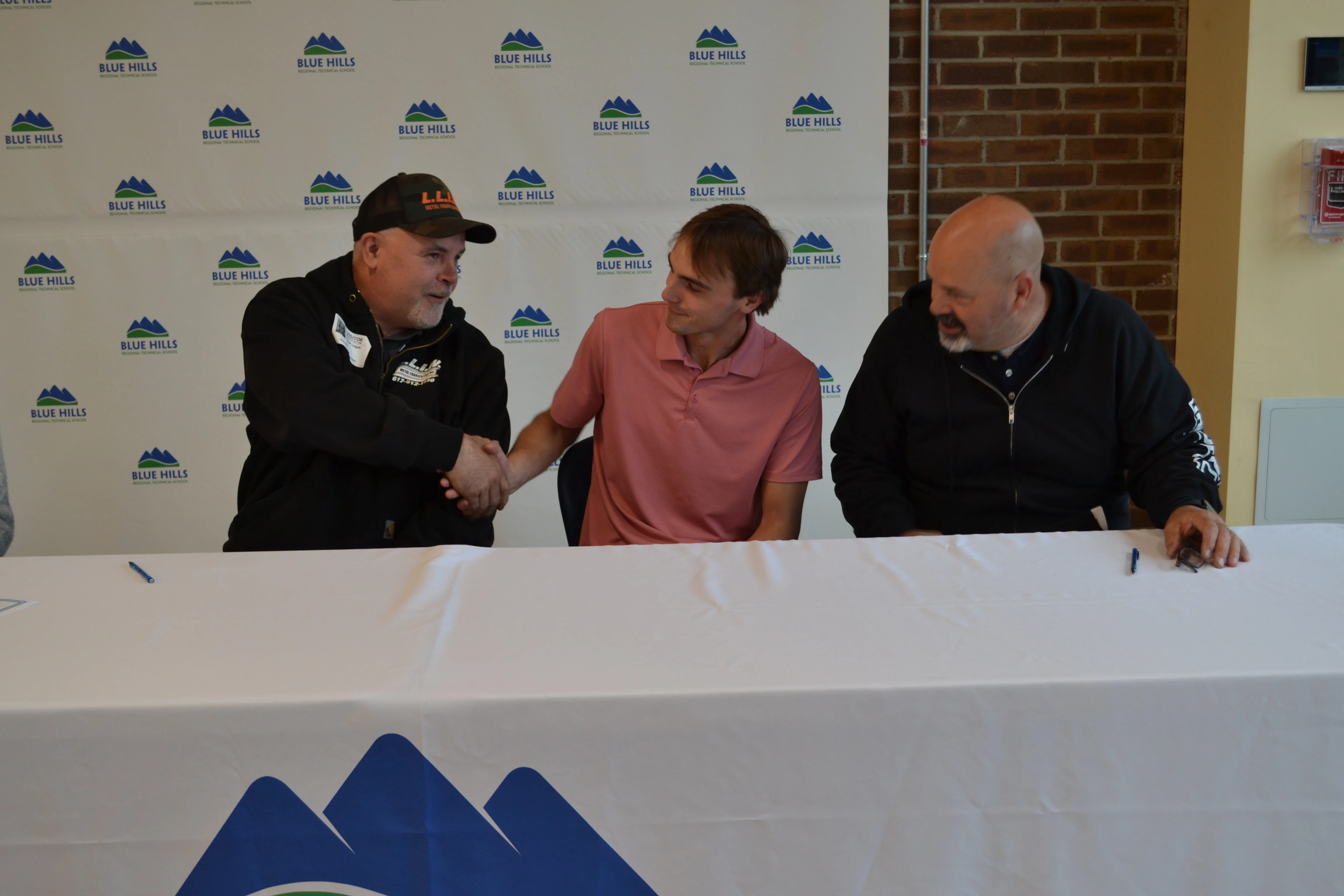 Jake Logan shakes hand of prospective employer.