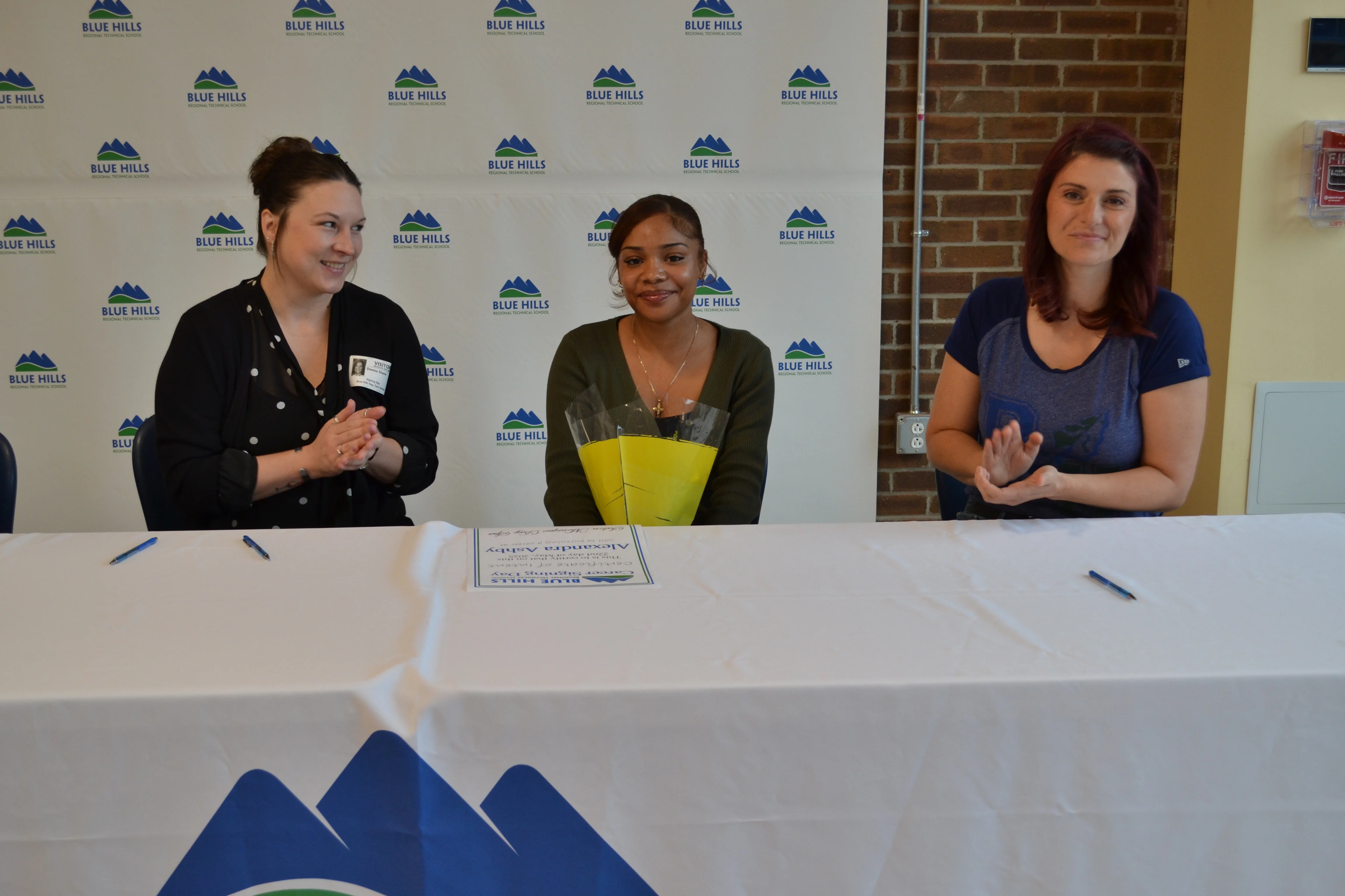 Alexandra Ashby posing for photo with future employer.