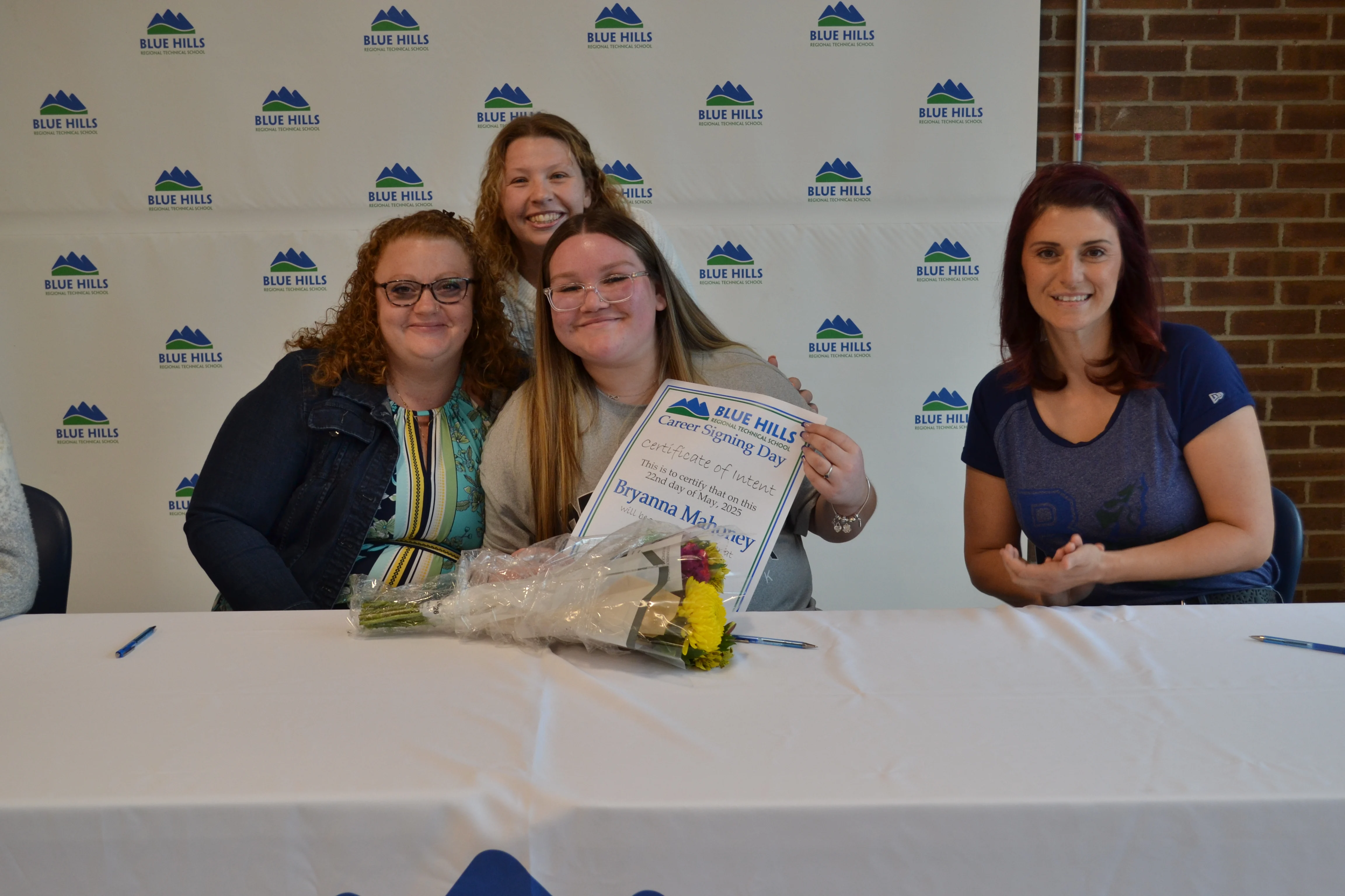Bryanna Mahoney posing with future employer.