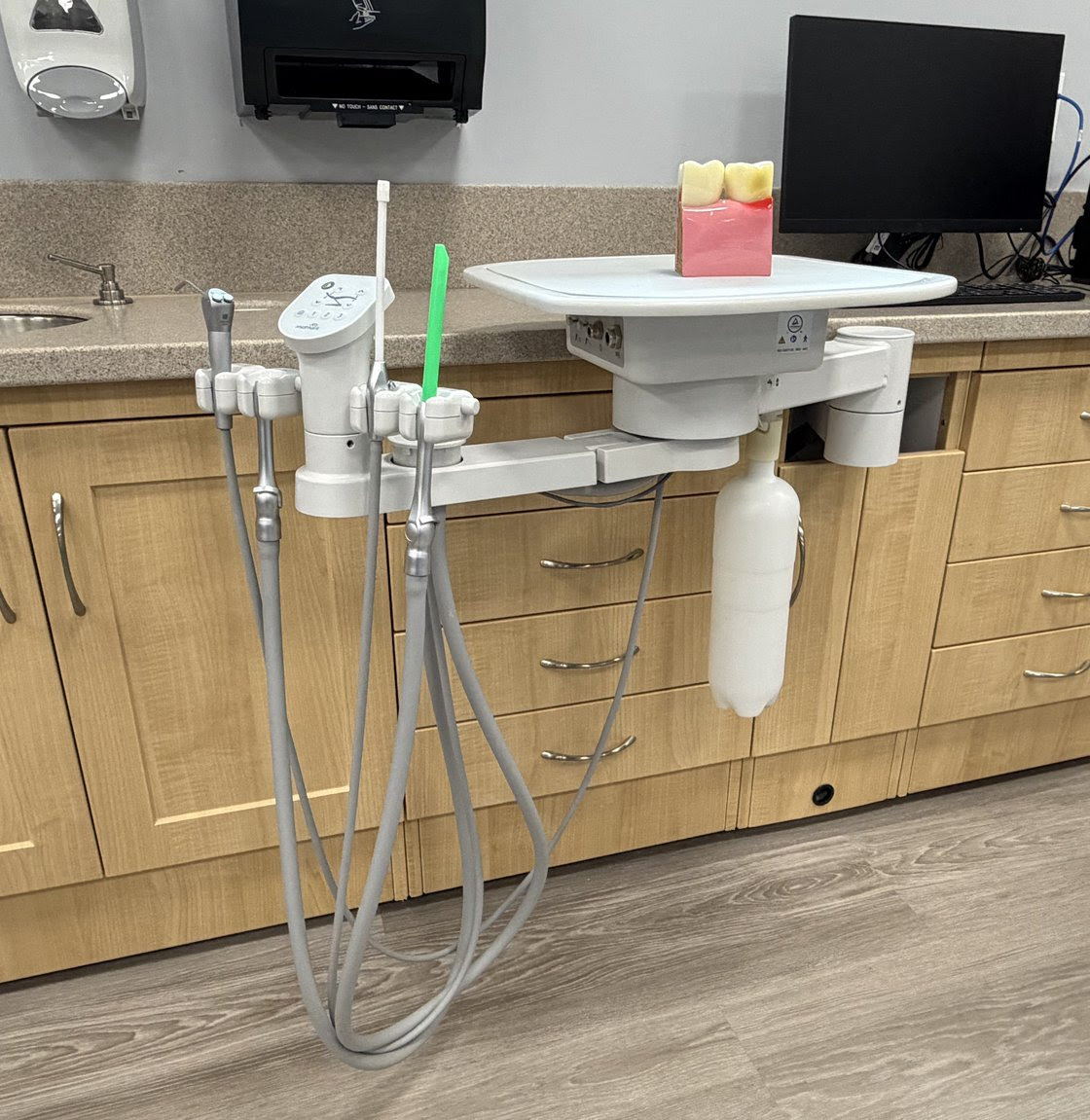 Image of an equipment table holding various dental tools